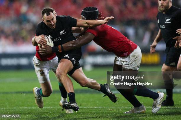 Israel Dagg of New Zealand is tackled by Liam Williams and Maro Itoje of the Lions during the International Test match between the New Zealand All...