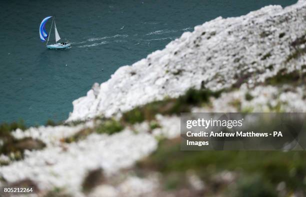 Sailing boats make their way around the Isle of Wight close to the Needles as they take part in the 2017 Round the Island Race.