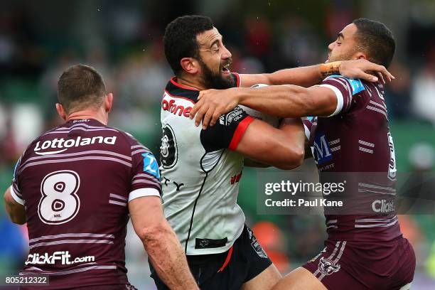 Ben Matulino of the Warriors gets tackled by Dylan Walker of the Sea Eagles during the round 17 NRL match between the Manly Sea Eagles and the New...