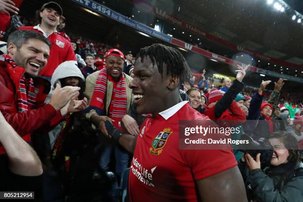 Maro Itoje of the Lions celebrates with the fans following their team's 24-21 victory during the second test match between the New Zealand All Blacks...