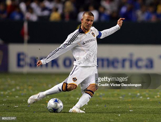 David Beckham of the Los Angeles Galaxy serves a cross from midfield against the San Jose Earthquakes in the second half during their MLS game at the...