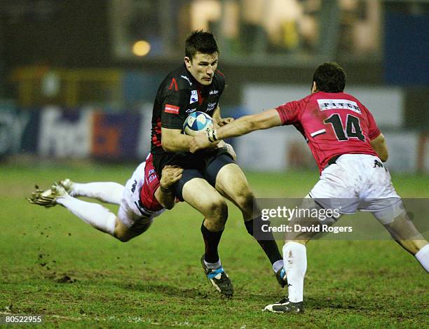 Chris Bell of Sale is tackled by Ronie Cooke during the European Challenge Cup quarter final match between Sale Sharks and Brive at Edgeley Park on...