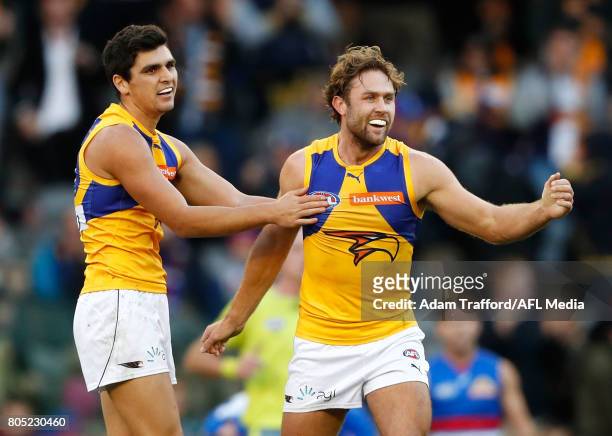 Tom Cole and Mark Hutchings of the Eagles celebrate on the final siren during the 2017 AFL round 15 match between the Western Bulldogs and the West...