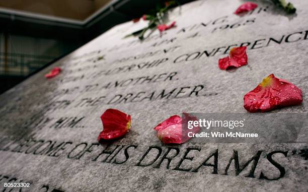 Commemorative plaque honoring Martin Luther King Jr. Is covered with flowers outside the Lorraine Hotel, the site where Martin Luther King Jr was...