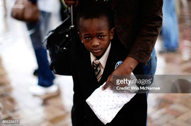 Year-old Oumar Pialla waits in his mothers arms to visit the National Civil Rights Museum inside the Lorraine Hotel, the site where Martin Luther...