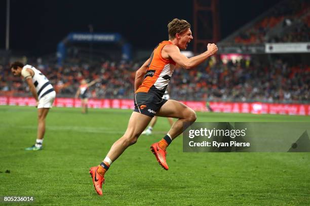 Lachie Whitfield of the Giants celebrates a goal during the round 15 AFL match between the Greater Western Sydney Giants and the Geelong Cats at...