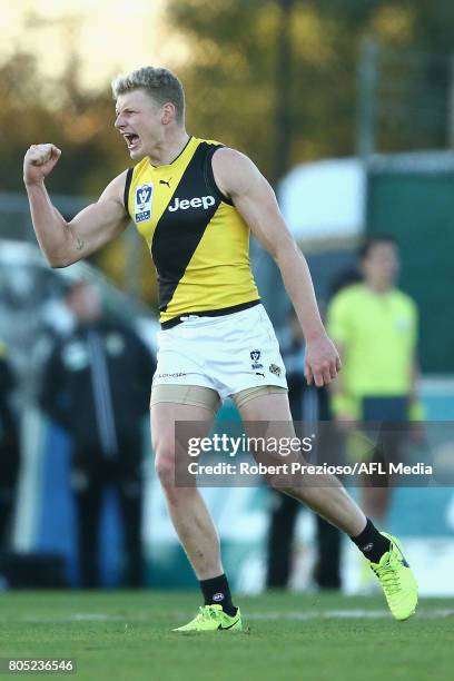 Taylor Hunt of Richmond Tigers celebrates a goal during the round 11 VFL match between the Essendon Bombers and the Richmond Tigers at Windy Hill on...