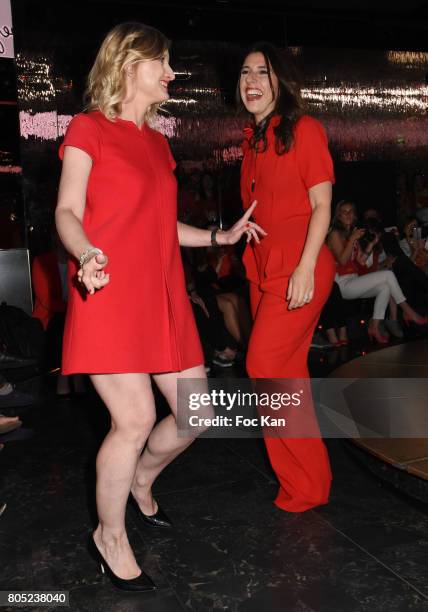 Karine De Menonville by Courreges and Nathalie Levy by Philippe Perisse walk the runway during the 'Red Defile' Auction Fashion Show Hosted by Ajila...