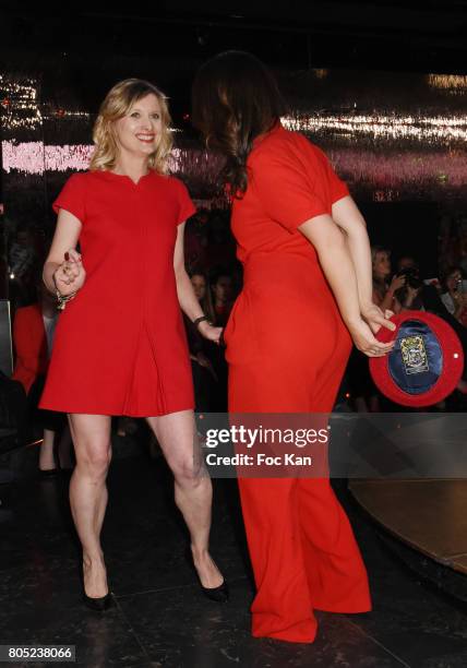 Karine De Menonville by Courreges and Nathalie Levy by Philippe Perisse walk the runway during the 'Red Defile' Auction Fashion Show Hosted by Ajila...