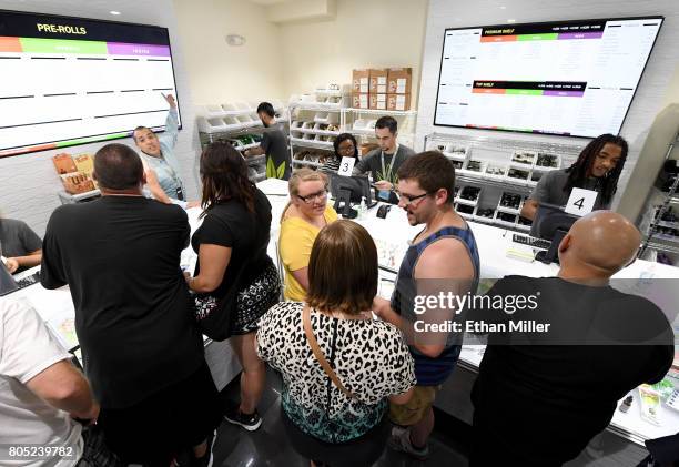 Customers buy cannabis products at Essence Vegas Cannabis Dispensary after the start of recreational marijuana sales began on July 1, 2017 in Las...