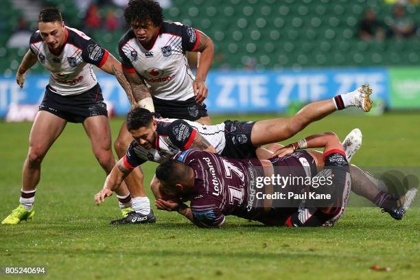 Addin Fonua-Blake of the Sea Eagles gets tackled during the round 17 NRL match between the Manly Sea Eagles and the New Zealand Warriors at nib...