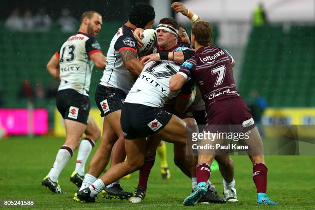 Darcy Lussick of the Sea Eagles gets tackled during the round 17 NRL match between the Manly Sea Eagles and the New Zealand Warriors at nib Stadium...