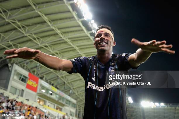 Fabio of Gamba Osaka celebrates his side's 3-2 victory with supporters after the J.League J1 match between Vegalta Sendai and Gamba Osaka at Yurtec...