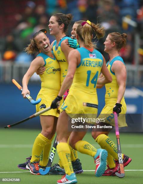 Emily Smith of Australia celebrates scoring a goal with her team mates during the Fintro Hockey World League 5/8 place playoff game between Belgium...