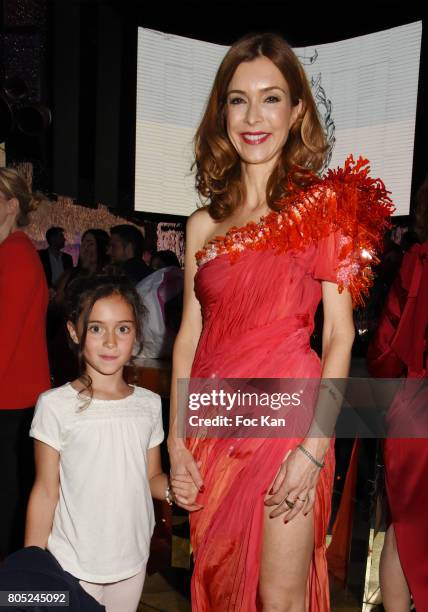 Presenter Veronique Mounier dressed by On Aura Tout Vu attends the 'Red Defile' Auction Fashion Show Hosted by Ajila Association Association Against...