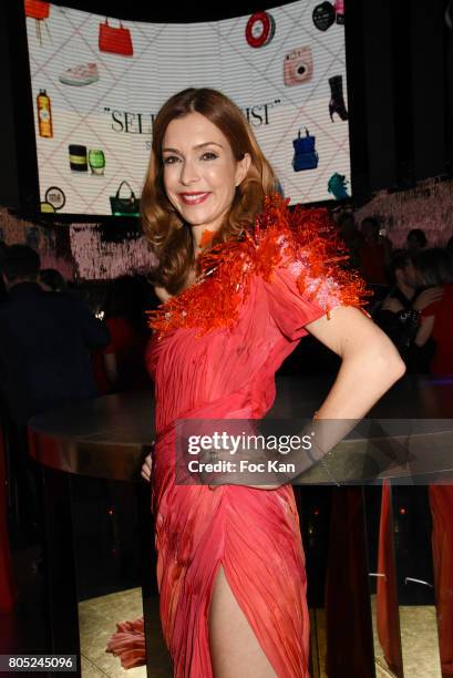 Presenter Veronique Mounier dressed by On Aura Tout Vu attends the 'Red Defile' Auction Fashion Show Hosted by Ajila Association Association Against...