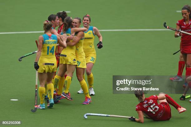 Emily Smith of Australia celebrates scoring a goal with her team mates during the Fintro Hockey World League 5/8 place playoff game between Belgium...