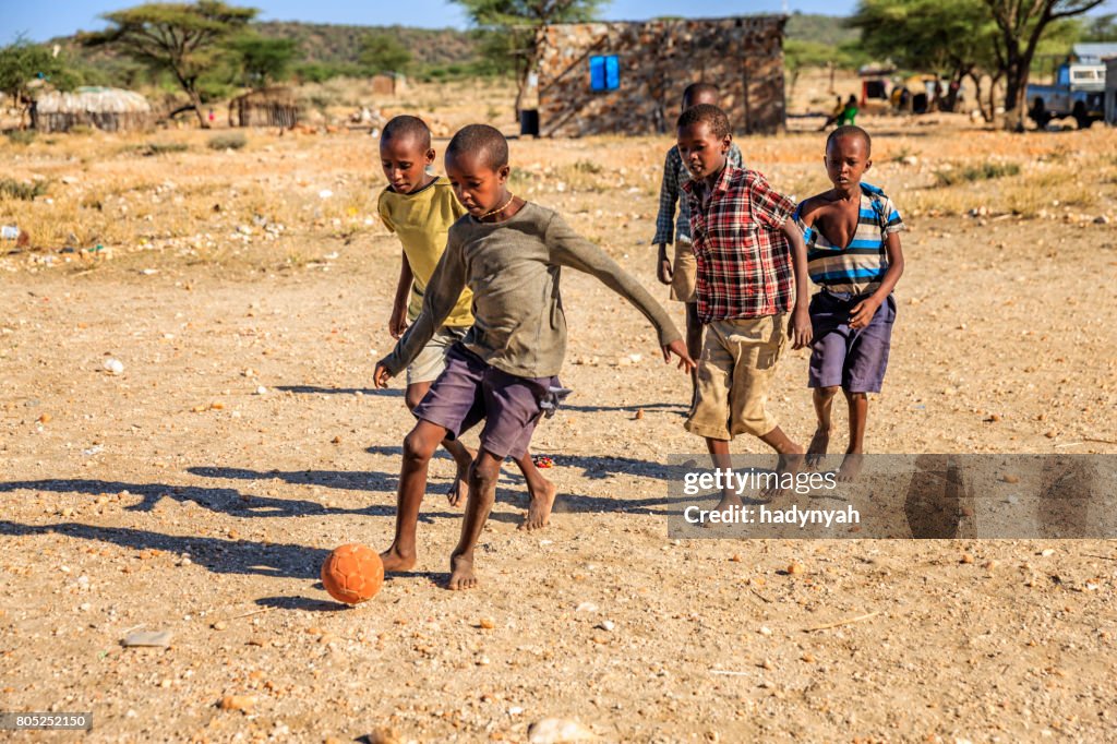 Barefoot African Children Playing Football In The Village East Africa  High-Res Stock Photo - Getty Images