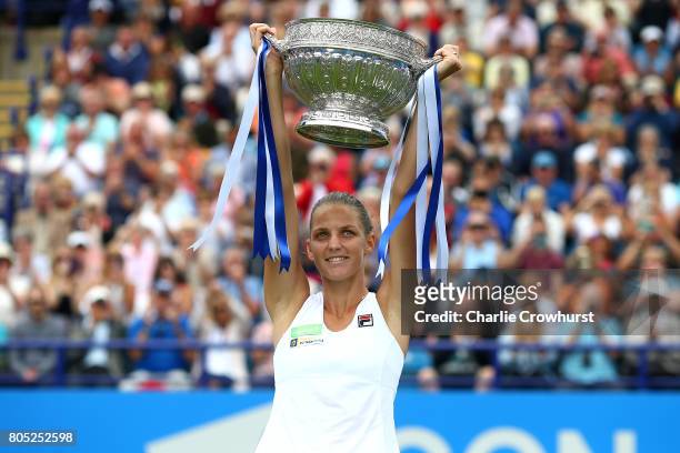 Karolina Pliskova of Czech Republic poses for photos with the cup after in winning her women's singles finals match against Caroline Wozniacki of...