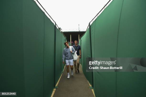 Andy Murray of Great Britain walks to practice at Wimbledon on July 1, 2017 in London, England.
