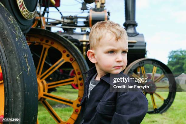 Harley James from Middleton in Teesdale helps to clean a steam engine during the Duncombe Park Steam Rally on July 1, 2017 in Helmsley, United...