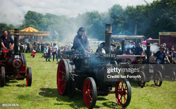 Miniature steam engines are driven into the main arena during the Duncombe Park Steam Rally on July 1, 2017 in Helmsley, United Kingdom. Held...