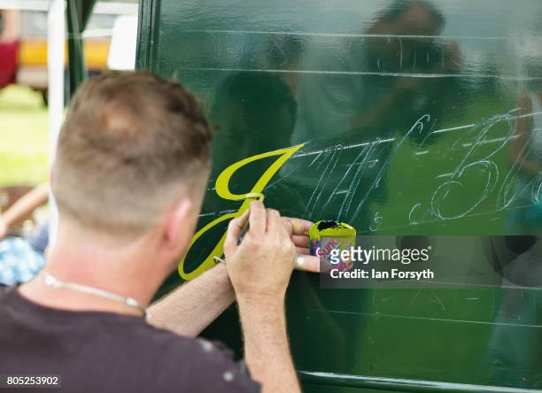 Sign writer gives a demonstration of his art during the Duncombe Park Steam Rally on July 1, 2017 in Helmsley, United Kingdom. Held annually in the...
