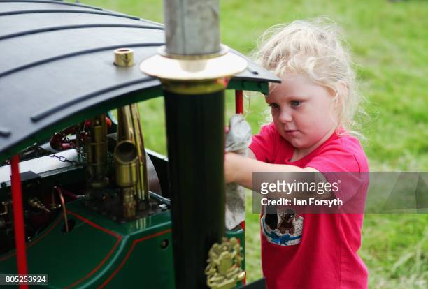 Felicity Barnfather from Swainby helps to clean a miniature steam engine during the Duncombe Park Steam Rally on July 1, 2017 in Helmsley, United...