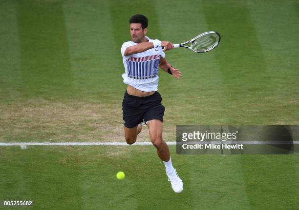 Novak Djokovic of Serbia hits a forehand during his mens singles final against Gael Monfils of France on day seven of the Aegon International...