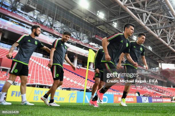 Hirving Lozano and Hector Herrera warm up during the Mexico training session on July 1, 2017 in Moscow, Russia.