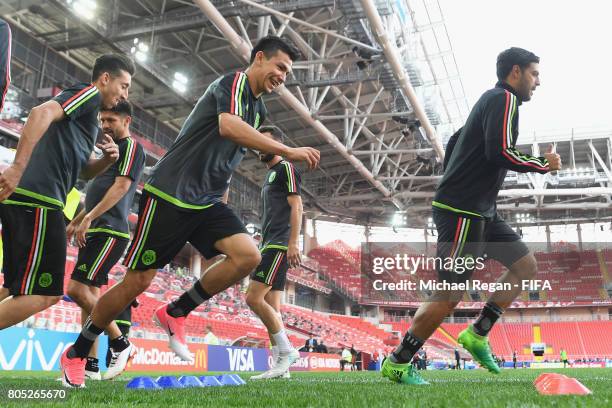 Hector Herrera, Hirving Lozano and Carlos Vela warm up during the Mexico training session on July 1, 2017 in Moscow, Russia.