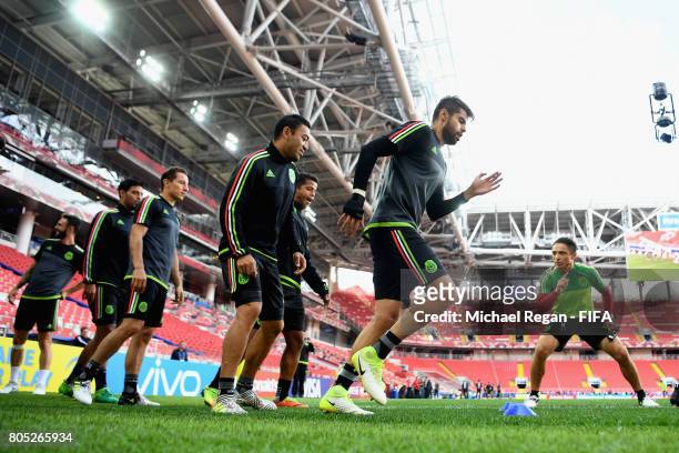 Marco Fabian and Nestor Araujo warm up during the Mexico training session on July 1, 2017 in Moscow, Russia.