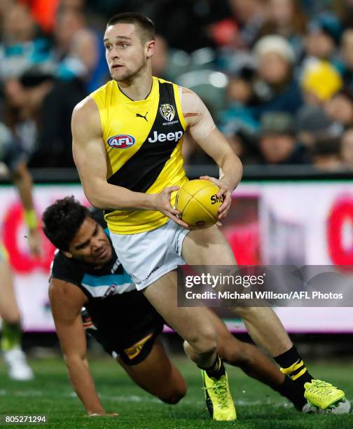 Jayden Short of the Tigers and Jake Neade of the Power in action during the 2017 AFL round 15 match between the Port Adelaide Power and the Richmond...