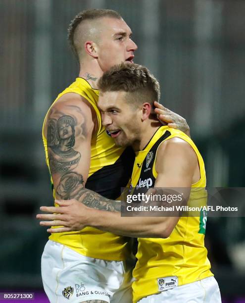 Dustin Martin and Dan Butler of the Tigers celebrate during the 2017 AFL round 15 match between the Port Adelaide Power and the Richmond Tigers at...