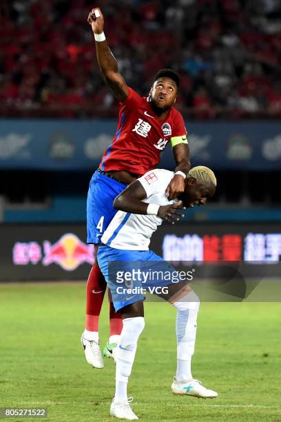 Eddi Gomes of Henan Jianye and Mbaye Diagne of Tianjin Teda compete for the ball during 2017 Chinese Super League 15th round match between Henan...