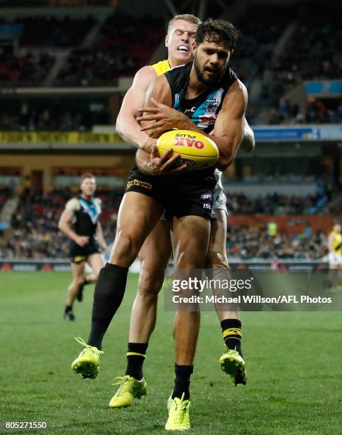 Paddy Ryder of the Power and Josh Caddy of the Tigers compete for the ball during the 2017 AFL round 15 match between the Port Adelaide Power and the...