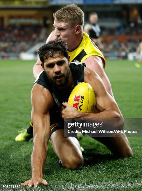 Paddy Ryder of the Power and Josh Caddy of the Tigers compete for the ball during the 2017 AFL round 15 match between the Port Adelaide Power and the...