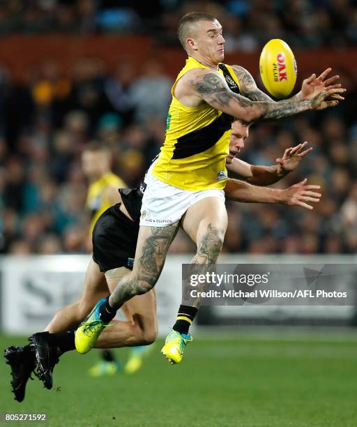 Dustin Martin of the Tigers and Brad Ebert of the Power compete for the ball during the 2017 AFL round 15 match between the Port Adelaide Power and...