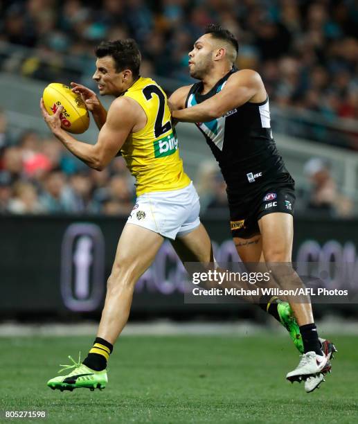 Sam Lloyd of the Tigers and Jarman Impey of the Power compete for the ball during the 2017 AFL round 15 match between the Port Adelaide Power and the...