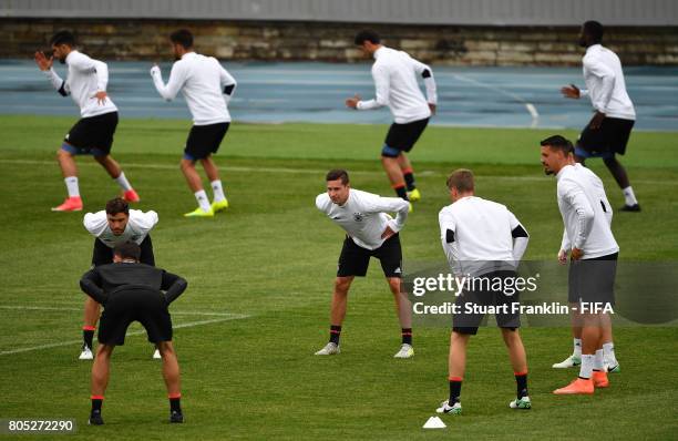 Julian Draxler of Germany warms up with his teamates during a training session of the German national football team on July 1, 2017 in Saint...