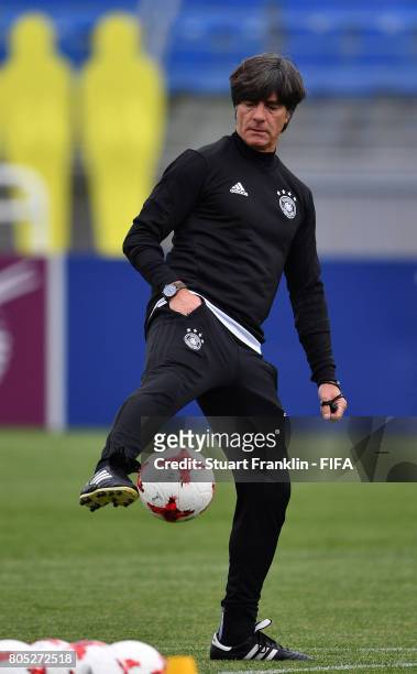Joachim Loew, head coach of Germany controls a ball during a training session of the German national football team on July 1, 2017 in Saint...