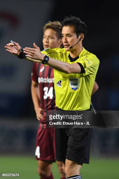 Referee Hiroyuki Kimura gestures during the J.League J1 match between Kawasaki Frontale and Vissel Kobe at Todoroki Stadium on July 1, 2017 in...