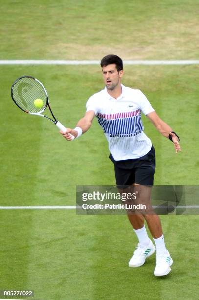 Novak Djokovic of Serbia volleys during the Final match against Gael Monfils of Franceon day seven on July 1, 2017 in Eastbourne, England.