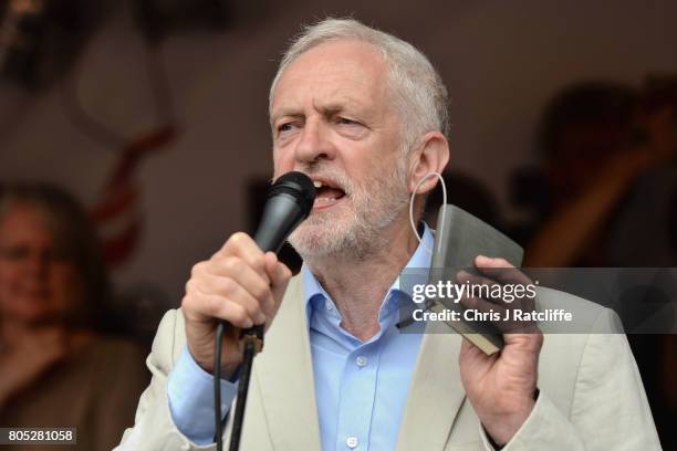 Labour Party leader, Jeremy Corbyn speaks to demonstrators during the 'Not One Day More' march at Parliament Square on July 1, 2017 in London,...