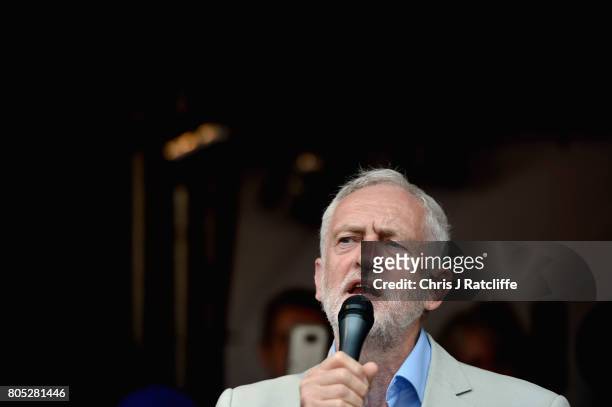 Labour Party leader, Jeremy Corbyn speaks to demonstrators during the 'Not One Day More' march at Parliament Square on July 1, 2017 in London,...