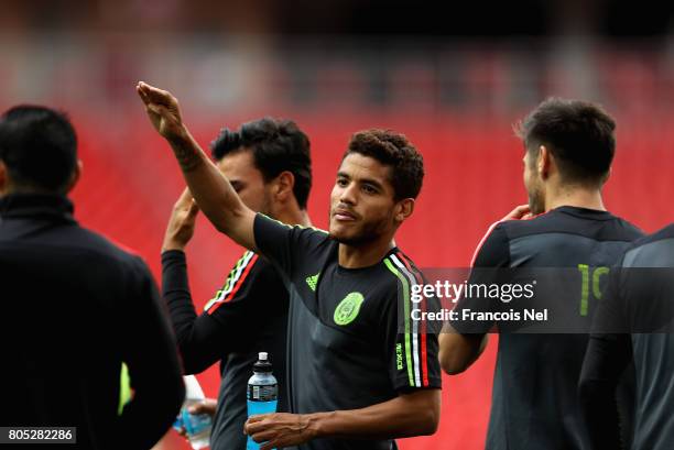 Jonathan Dos Santos speaks to team mates during the Mexico training session on July 1, 2017 in Moscow, Russia.