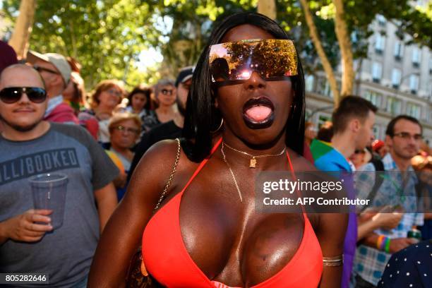 Participant sticks out his tongue during the WorldPride 2017 parade in Madrid on July 1, 2017. Revellers took to the rainbow streets of Madrid today...