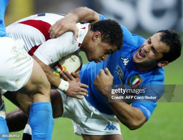 England's center Jason Robinson challenges Italy's center Cristian Stoica during the VI nations rugby union match between Italy and England, 15...