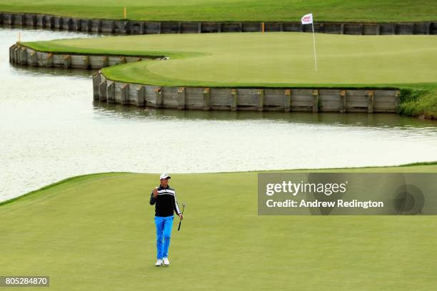 Alexander Bjork of Sweden celebrates as he finishes his round on the 18th green during day three of the HNA Open de France at Le Golf National on...