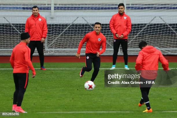 Alexis Sanchez and team mates exercise during a Chile training session ahead of their FIFA Confederations Cup Russia 2017 final against Germany at...